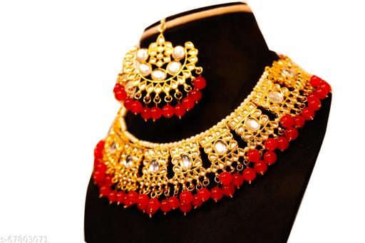 Schmuk's-Gold-Plated-heavy-Kundan---Red-Pearl-jewellery-with-earrings-&-Maang-Tika