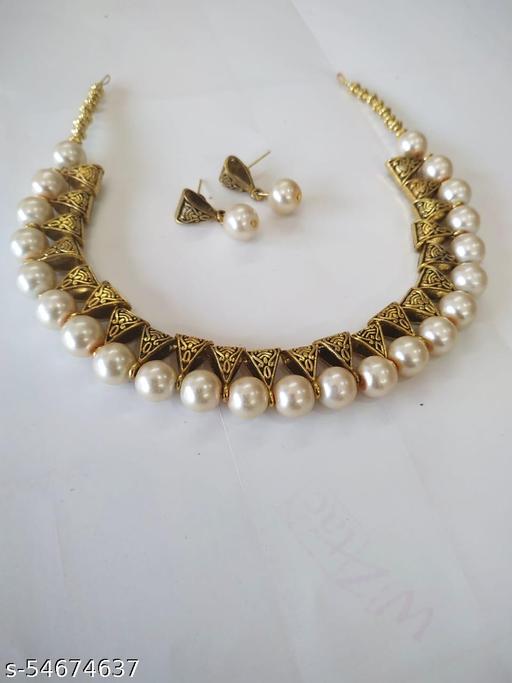 Pearl-choker-with-antique-golden-charms-jewellery-set
